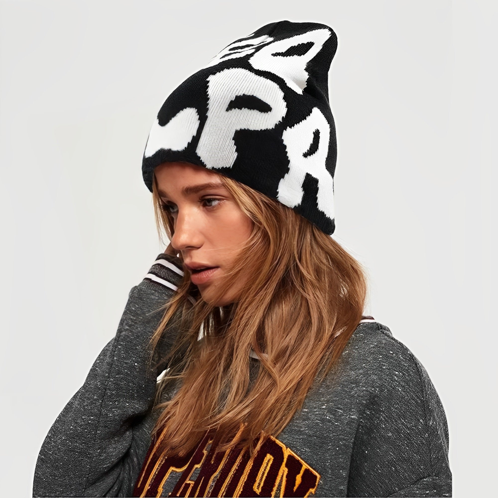 This image shows a woman wearing a mea culpa beanie.